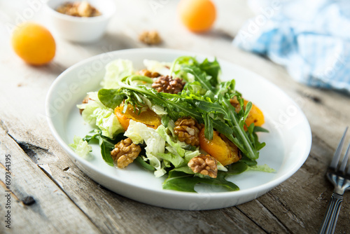 Healthy leaf salad with apricot and walnut