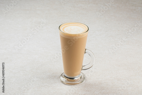 Glass mug of hot latte coffee macchiato