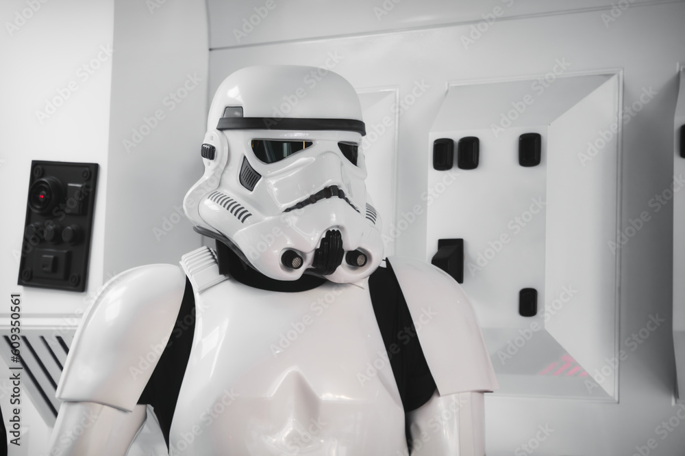 Naklejka premium 20 May 2023, St. Julians - Malta: A stormtrooper from the Star Wars movie in full body armor suit costume standing in a spaceship background setting