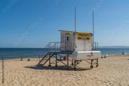 Bournemouth, UK - May 26th 2023: The RNLI lifeguard watch post on the sandy Alum Chine Beach in front of the sea.
