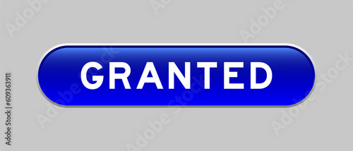 Blue color capsule shape button with word granted on gray background