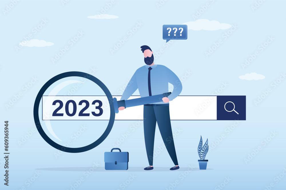 2023 job research or vision. New Year resolution. New business opportunities or career challenges. Businessman uses magnifying glass for discovering websites from search box. 2023 job research or vision. New Year resolution. New business opportunities or career challenges. Businessman uses magnifying glass for discovering websites from search box.