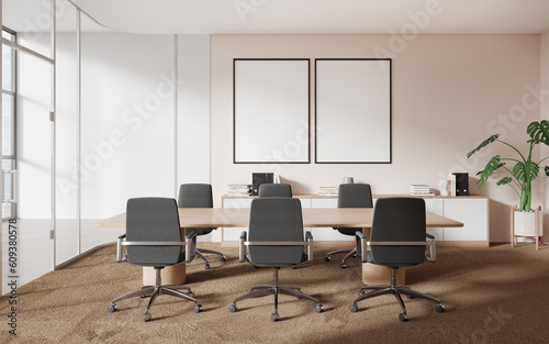 Light pink office meeting room interior with posters