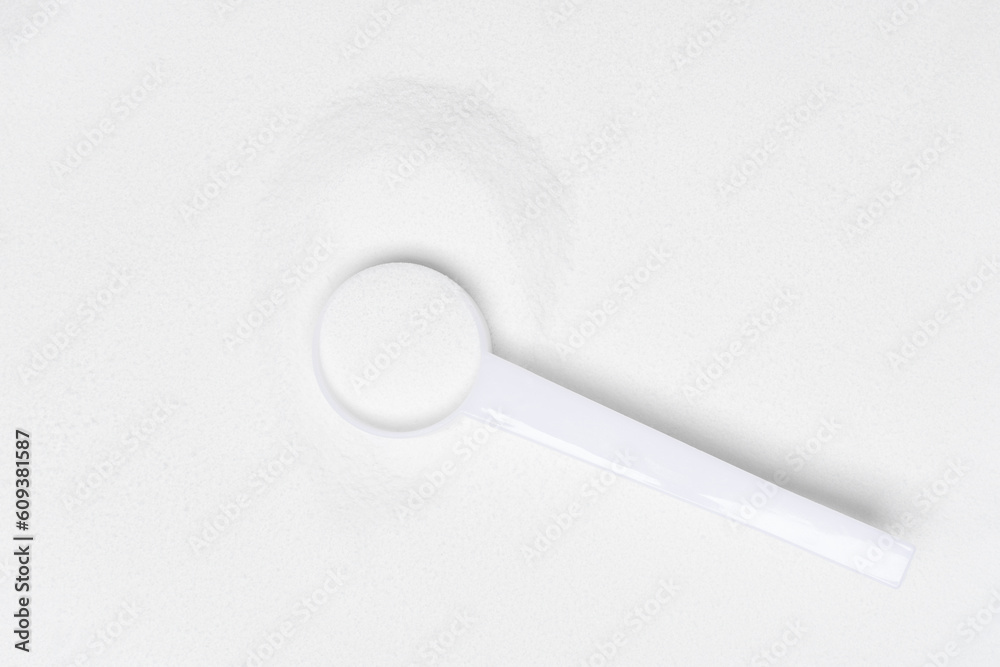 Pile of collagen powder with spoon isolated on white background. Top view. Flat lay. Pile of collagen powder with spoon isolated on white background. Top view. Flat lay.