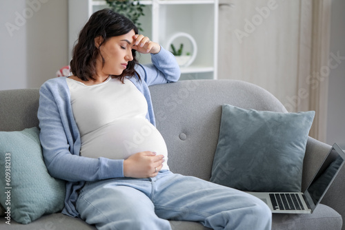 Pregnant woman experiencing...