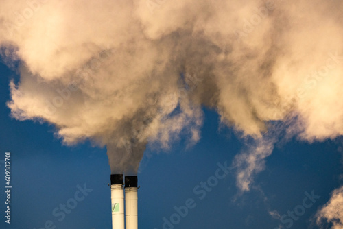 Industrial pollution in the factory, exhaust gas from smoke chimneys. Industrial area, thick plumes of smoke. Global Climate change © Jean Isard