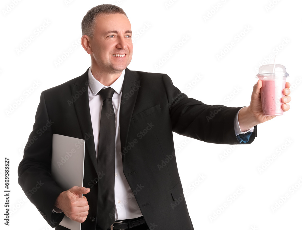 Mature businessman with glass of fruit smoothie and laptop on white background Mature businessman with glass of fruit smoothie and laptop on white background