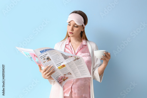 Young woman in pajamas with...