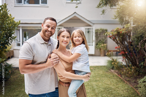 Portrait, happy family and kid outdoor at new house, real estate and building mortgage in residential neighborhood. Mother, father and child smile outside for property investment, moving or homeowner