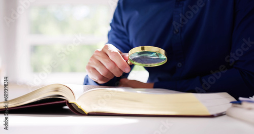 Lawyer Law Book With Magnifying Glass