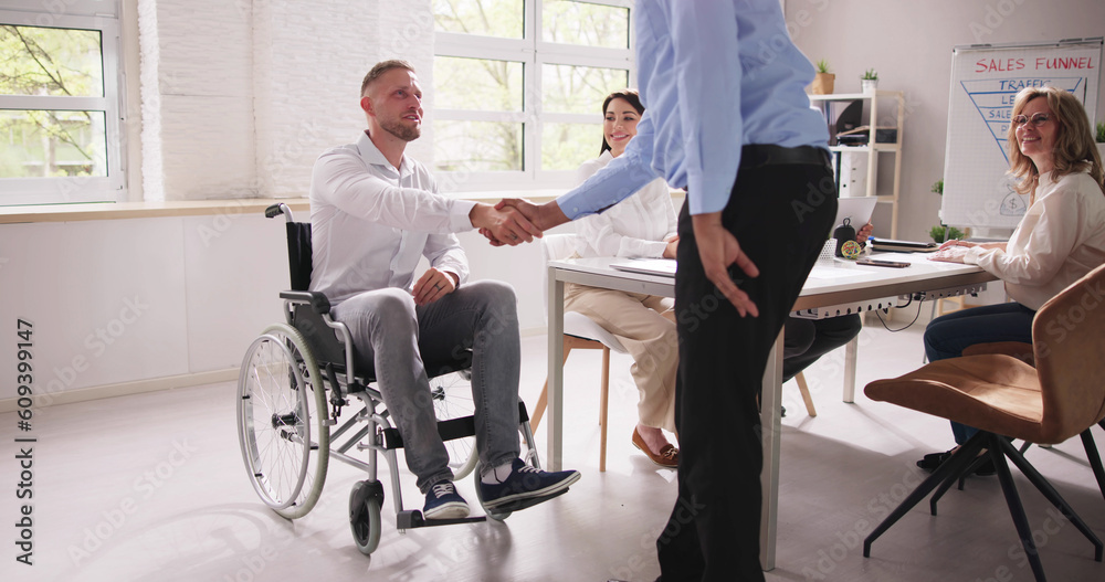 Fototapeta premium Person In Wheel Chair Handshake