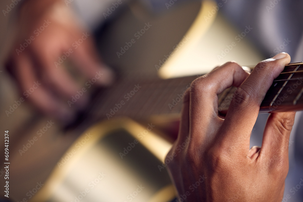 Playing guitar, learning and hands of man on instrument for music and strumming for entertainment. Jazz, talent and closeup of a male musician with acoustic music, practicing and instrumental hobby Playing guitar, learning and hands of man on instrument for music and strumming for entertainment. Jazz, talent and closeup of a male musician with acoustic music, practicing and instrumental hobby