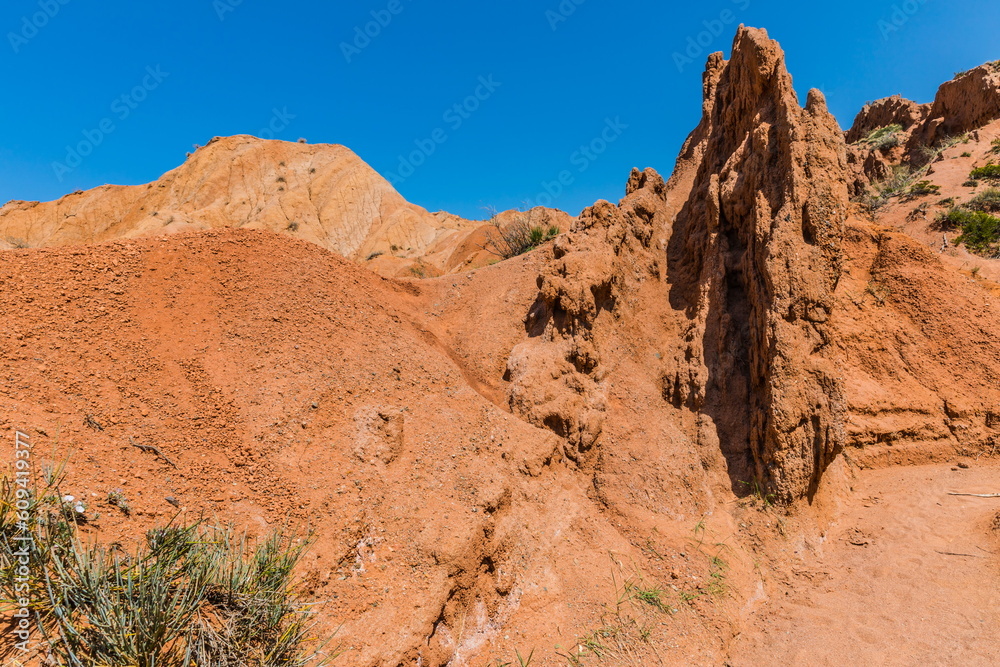 Skazka (Fairytale) Canyon - the most unusual and picturesque gorge on the southern shore of Issyk-Kul, the main attraction in the vicinity of the lake, Kyrgyzstan Skazka (Fairytale) Canyon - the most unusual and picturesque gorge on the southern shore of Issyk-Kul, the main attraction in the vicinity of the lake, Kyrgyzstan