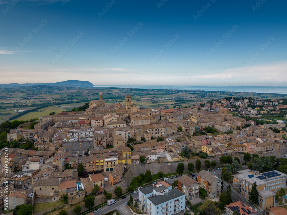 Fototapeta premium Italy, June 02, 2023: aerial view of the beautiful medieval village of Potenza Picena. The village is located on the Marche hills in the province of Macerata