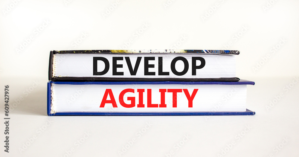 Develop agility symbol. Concept words Develop agility on beautiful books on a beautiful white table white background. Business, support and develop agility concept. Copy space.