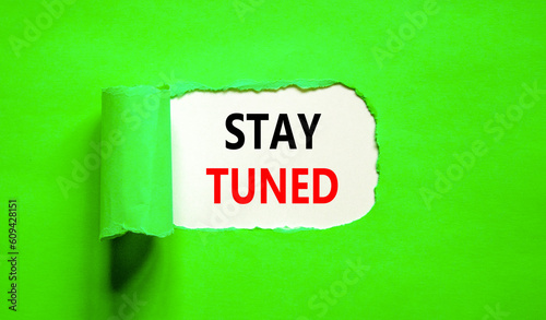 Stay tuned symbol. Concept words Stay tuned on beautiful white paper on a beautiful green background. Business, support, motivation, psychological and stay tuned concept. Copy space.