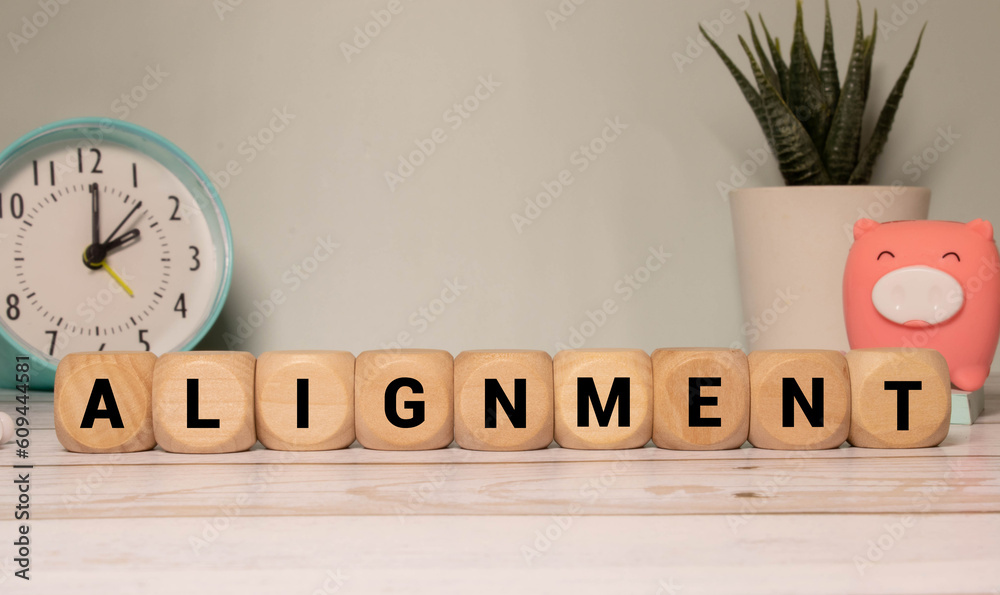 Alignment. Cubes form the word Alignment. Broad concept from business ...