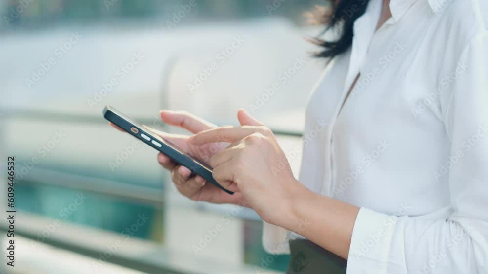 Close up on business woman using smart phone for reading message and texting on communication application, social media, remote work and online lifestyle concept.