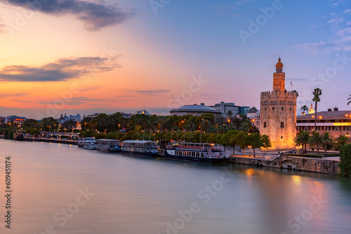 Famous watchtower Golden Tower or Torre del Oro and River Guadalquivir at sunset, Seville, Andalusia, Spain