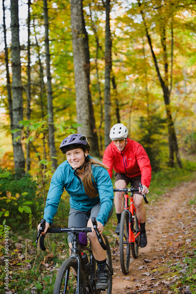A couple gravel biking near Blue Ridge Parkway in autumn, Pisgah North Carolina A couple gravel biking near Blue Ridge Parkway in autumn, Pisgah North Carolina