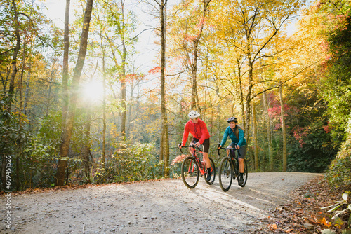 A couple gravel biking near Blue Ridge Parkway in autumn, Pisgah North Carolina photo