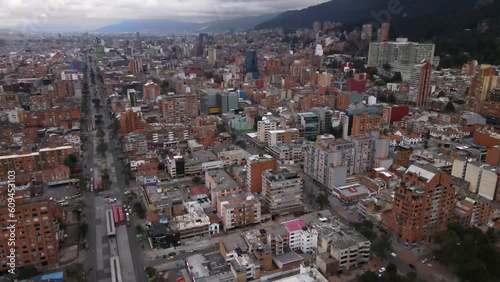 Bogotá, Colombia, panoramic view of the city in the direction of the eastern hills, buildings and vehicle traffic. From Caracas Avenue. photo