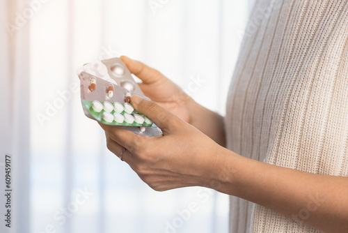 Hand holding a blister pack...
