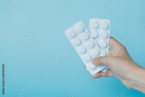 Hand holding a blister pack...