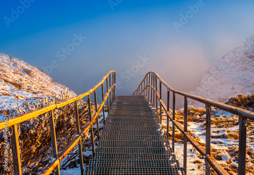 stairs on mountain top with fog. Ceahlau, Romania