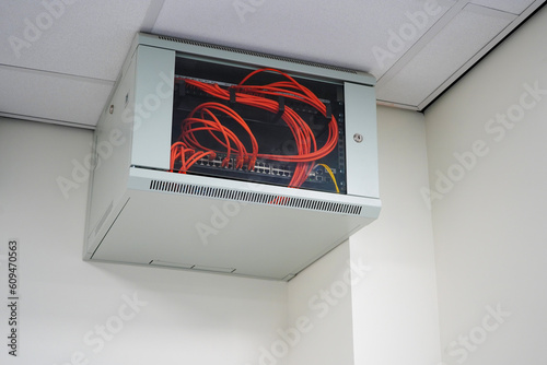Close up of a network switch cabinet on a wall