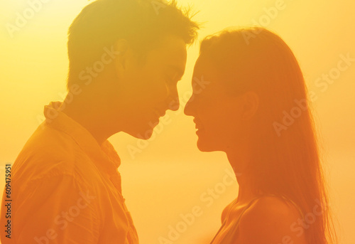 Loving Silhouette at Sunset, Bonding Couple Embracing in Backlit Portrait