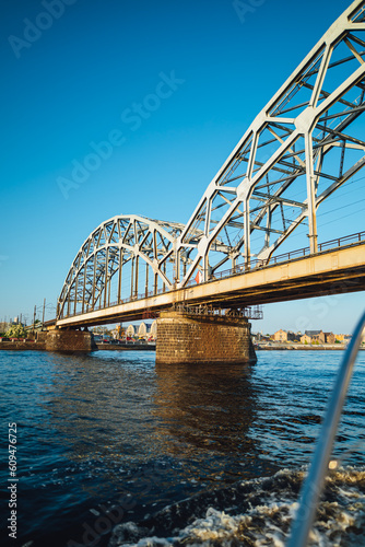 Large metal train bridge over river in the city of Riga, Latvia
