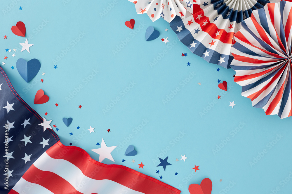 Obraz premium USA Independence Day concept. Top view flat lay of american flag, patriotic folding paper fans, hearts, star-shaped confetti on light blue background with space for promo or greetings