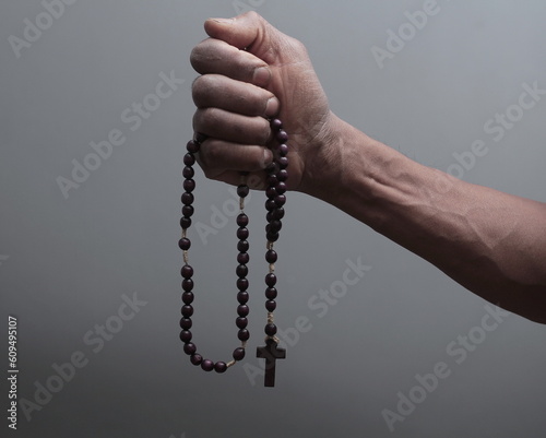 hand with cross praying to God on grey background with people stock image stock photo