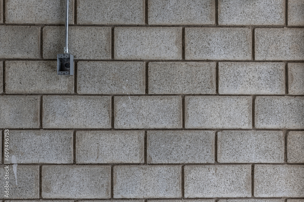Obraz premium Pattern of grey wall made of concrete bricks.Material of industry construction.
