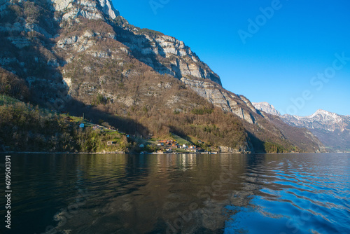 Beautiful view of Lake Walensee (Lake Walen or Lake Walenstadt) in canton St. Gallen and Glarus with a mountain range in the background. Switzerland, Europe
