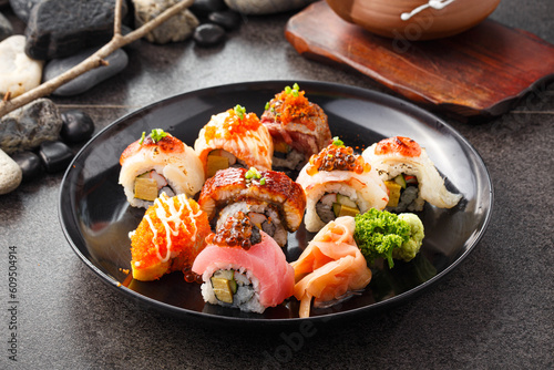 Sushi and Maki rolls, Japanese Traditional food (Vegetable and eggs roll by rice and seaweed on topping with raw fish and sauce)