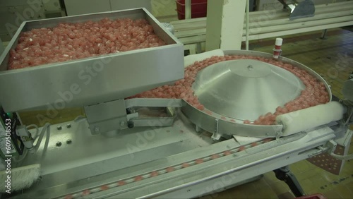 static medium shot of lollipops from the feeder box going to the the distributor disc and on speedbelt
