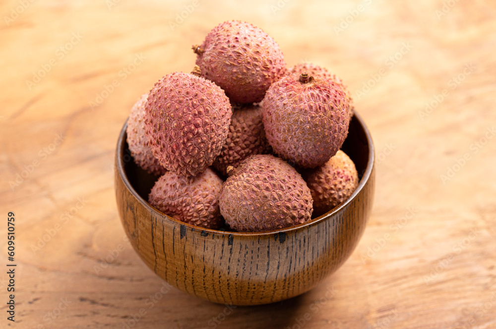 Fresh Lychee a Sweet and Juicy Tropical Fruit on a Wooden Table Fresh Lychee a Sweet and Juicy Tropical Fruit on a Wooden Table