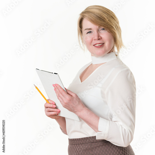Portrait of sincere smiling and happy blonde businesswoman holding clipboard and pencil in hands
