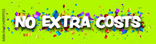 No extra costs sign over cut out foil ribbon confetti on green background.
