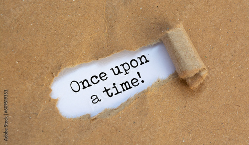 Photos once upon a time, text on white paper on torn craft paper