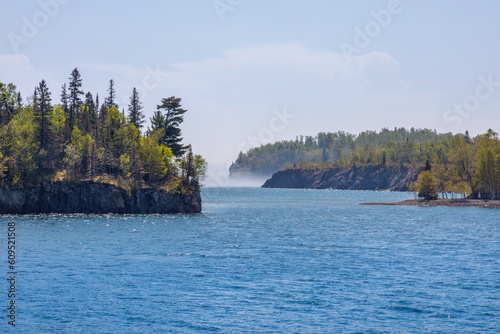 Lake Superior shoreline in northern Minnesota on a cool summer day with fog in the distance