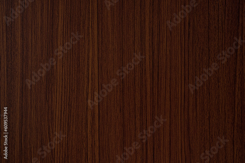 Reddish brown wood grain background.