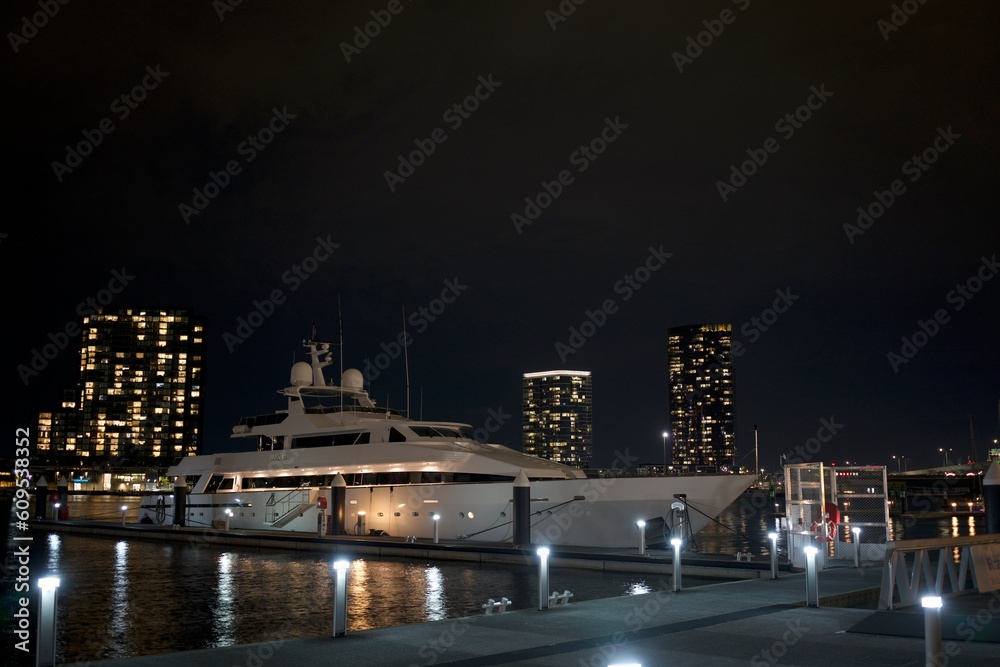 night view of white cruise ship parked at the port, docklands Melbourne