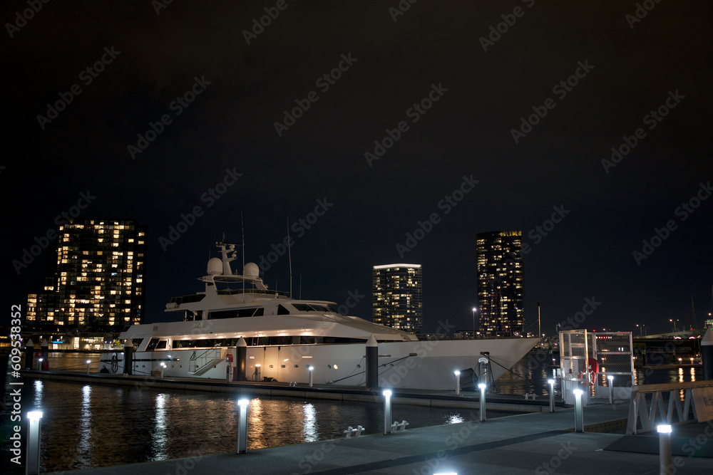 Fototapeta premium night view of white cruise ship parked at the port, docklands Melbourne