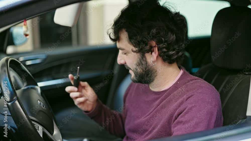 Young hispanic man smiling confident holding key of new car at street Young hispanic man smiling confident holding key of new car at street