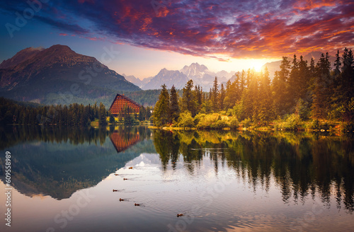 A fabulous evening view of calm lake Strbske pleso, surrounded by mountains. National Park High Tatra, Slovakia, Europe.