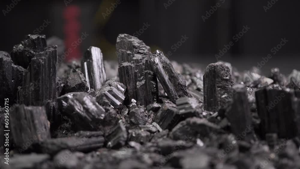 Mineral rocks black tourmaline obsidian stones with light, macro scene ready for design