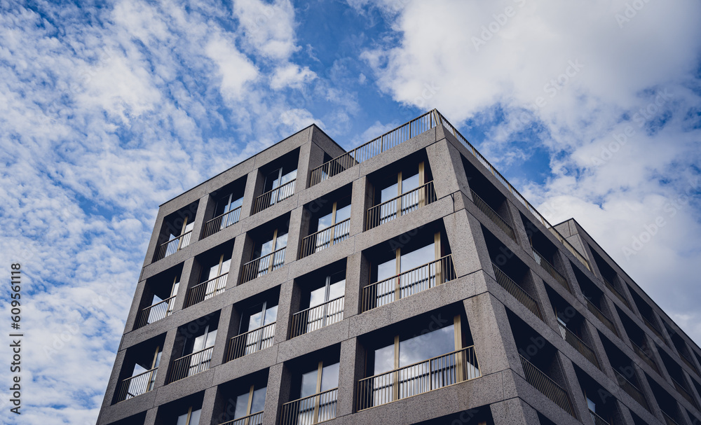 Modern building with glass facade at the clear sky background Modern building with glass facade at the clear sky background